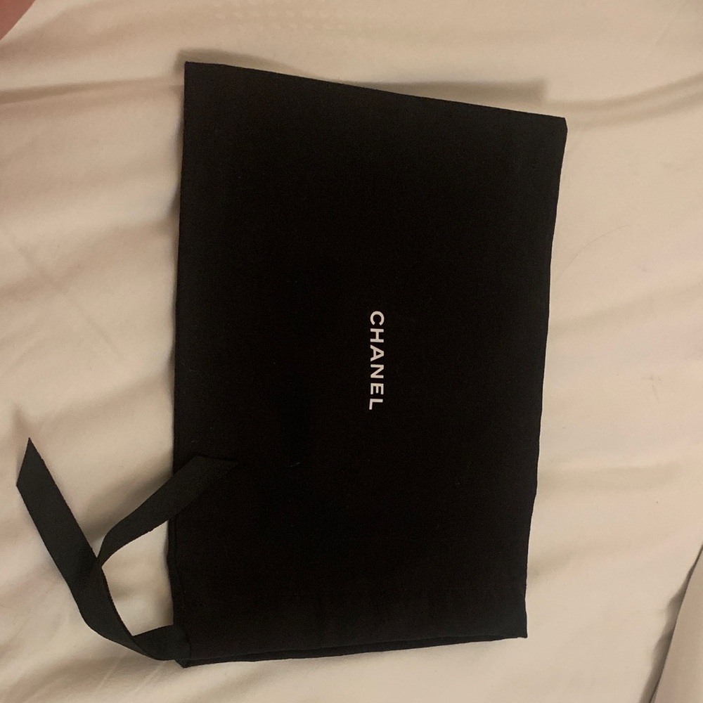 Authentic medium size  rare Chanel brand new pouch with strings. Travel perfect